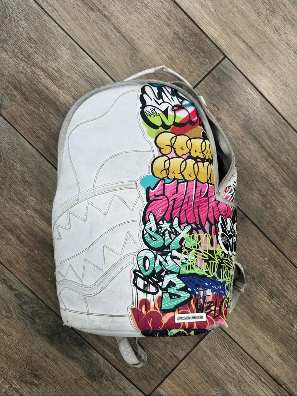 Sprayground White Backpack with Multicolor Graffiti